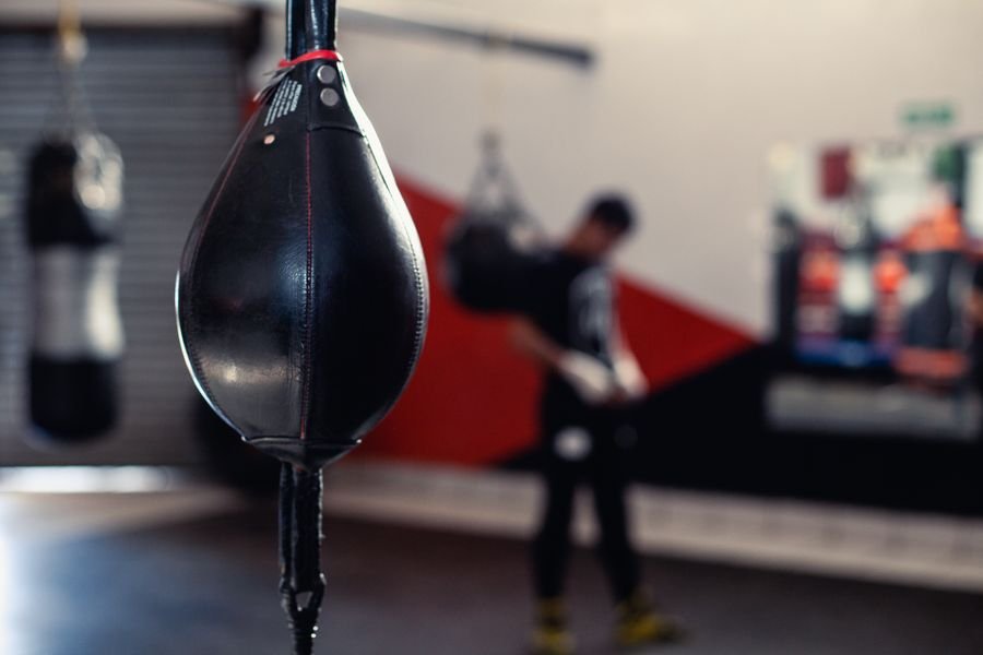 Speed bag and boxing equipment inside a working gym